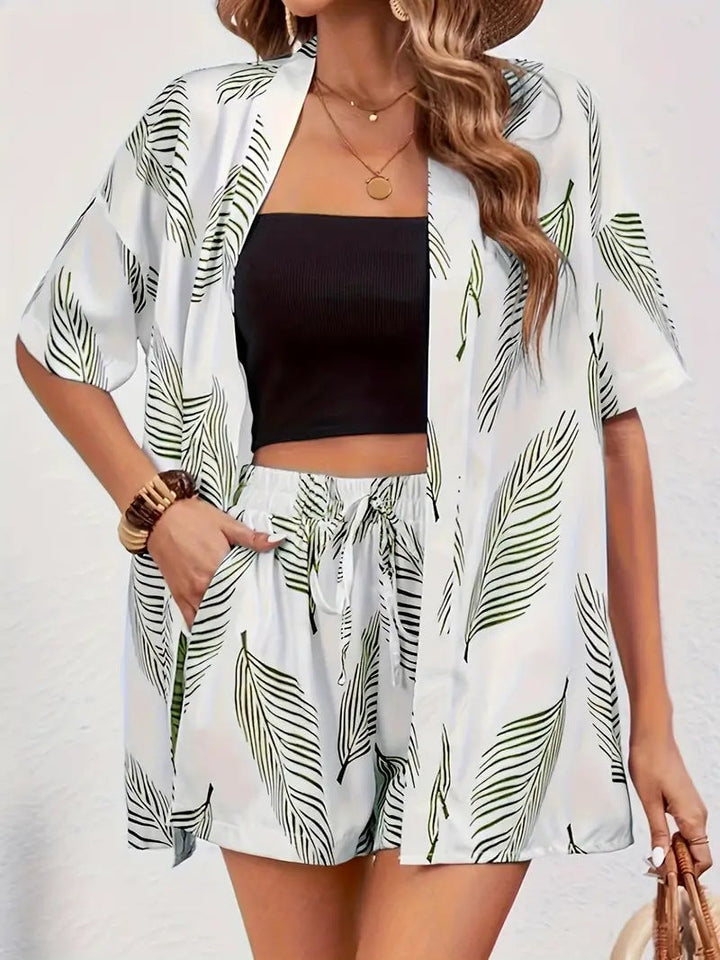 Woman in green floral kimono cardigan and matching high-waist shorts