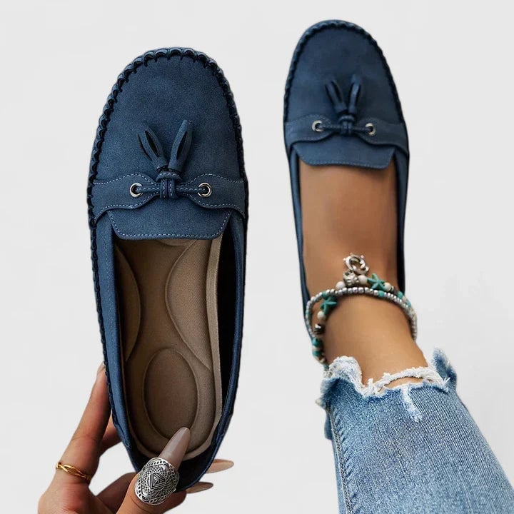 Top-down view of Clea bow loafers in blue highlighting the bow and tassel vamp detail