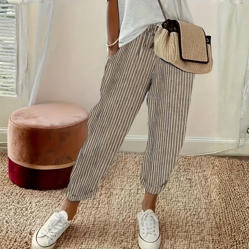 Women's striped wide leg pants with mid-rise waist and side pockets, shown in full-length front view