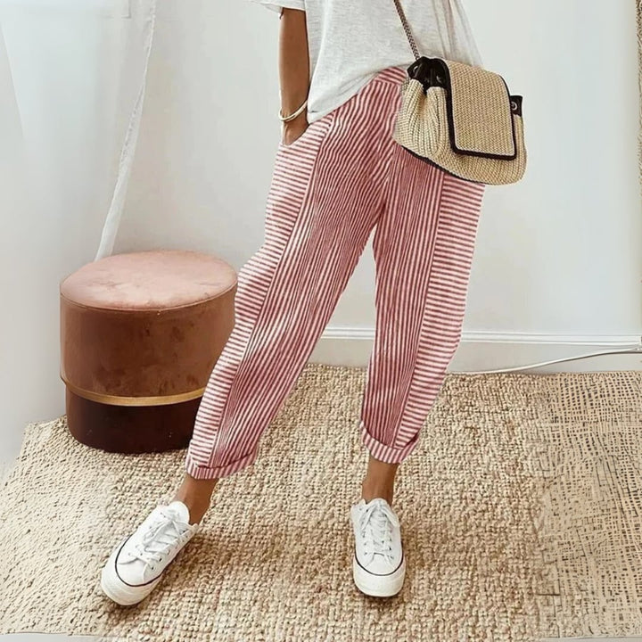 Side view of women's striped wide leg pants highlighting the wide leg drape and relaxed fit