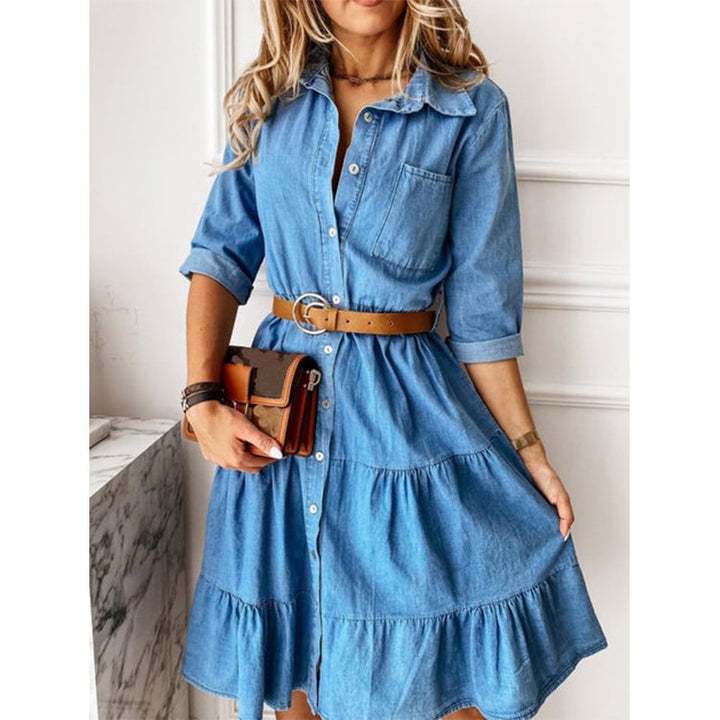 Woman wearing the Clementine blue flowy casual summer dress with a relaxed flowing skirt and defined waist detail