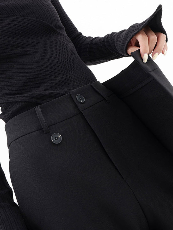 Full-length side view of Cleo baggy trousers in grey showing wide-leg silhouette