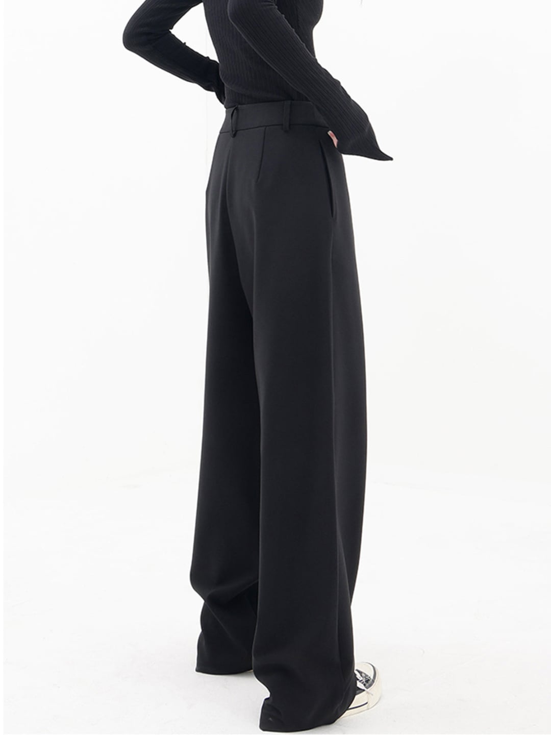 Flat lay of Cleo grey baggy trousers highlighting fabric texture and waistband