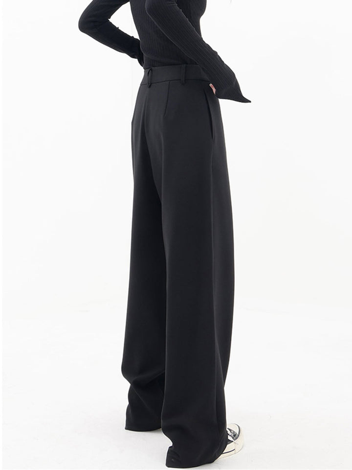 Flat lay of Cleo grey baggy trousers highlighting fabric texture and waistband