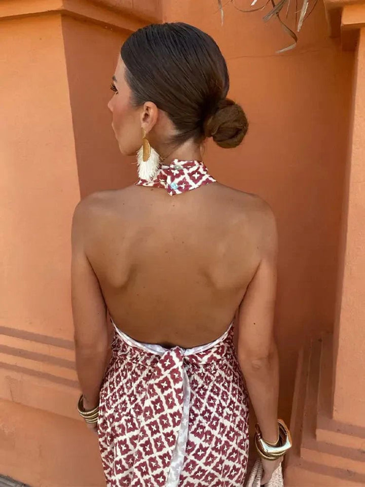 Side profile of the Cleo dress highlighting the smooth, elongated drape over the midsection