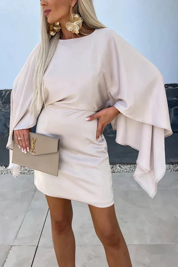 Close-up of the Cleo black cape sleeve mini dress showing the flowing batwing cape detail and round neckline