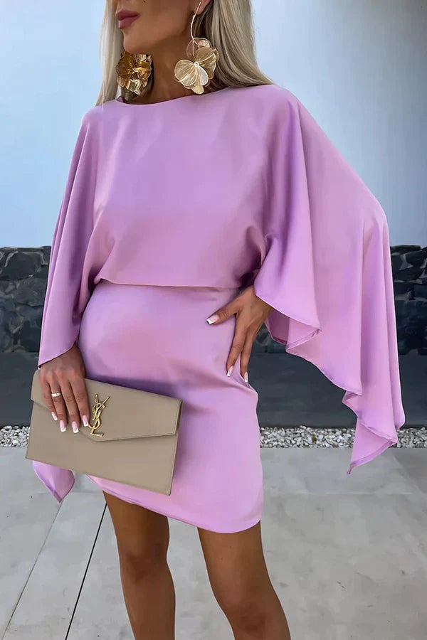 Cleo purple cape sleeve mini dress shown from the back, highlighting the open drape of the batwing sleeves
