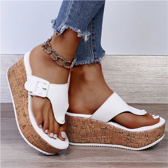 Side view of Cleo women's cork platform sandal with cushioned footbed and feminine bow accent