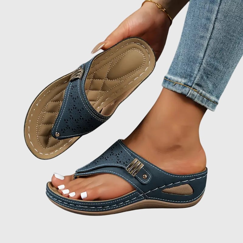 Side view of Cleo wedge sandal highlighting the low wedge sole and quilted footbed