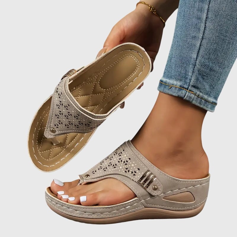 Top-down view of the Cleo wedge sandal showing the quilted tan insole and toe loop strap