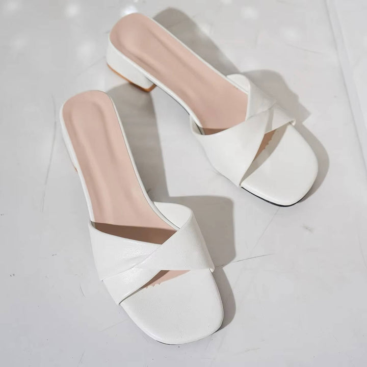 Clezza black crossover sandals, low block heel and square toe, back view