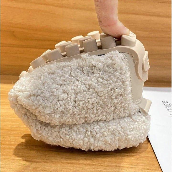 Cloud Moc moccasin slippers in brown shown from above on neutral background