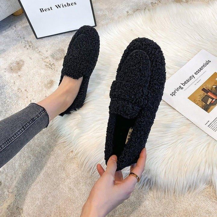 Flat lay of all three Cloud Moc slipper colors — cream, brown, and black