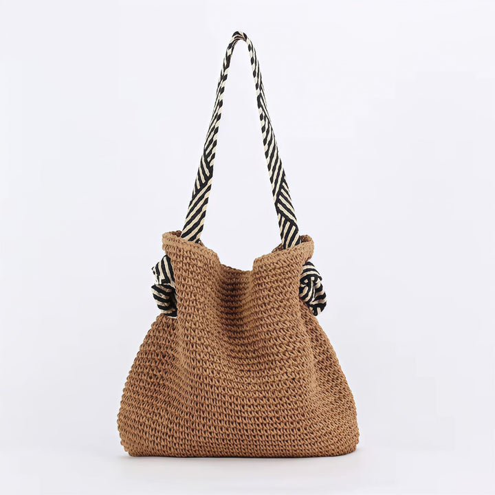 Close-up of textured handwoven exterior on a natural beige boho shoulder bag from Florimay