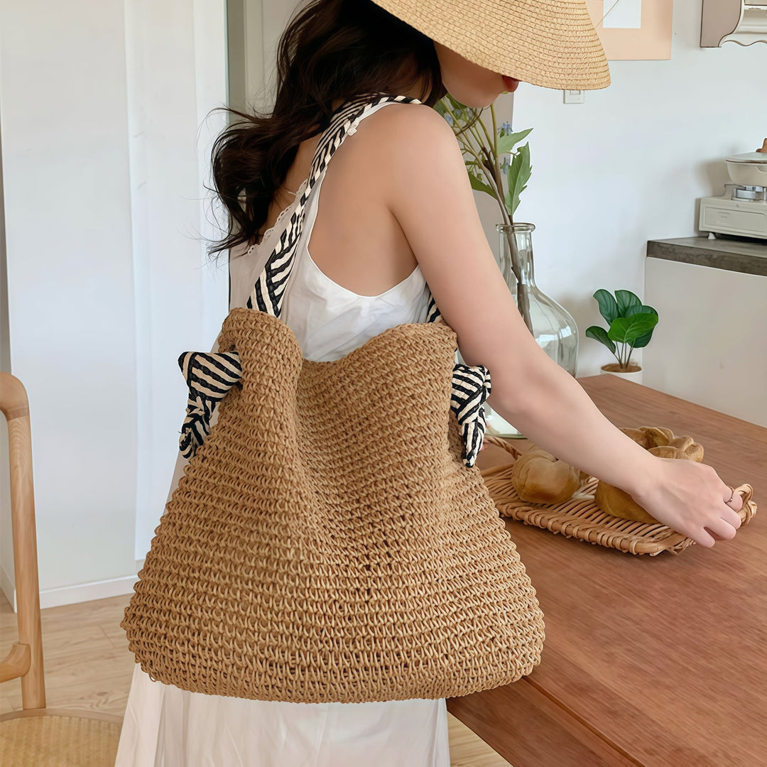 Model carrying warm brown boho shoulder bag on her shoulder, showing comfortable strap fit