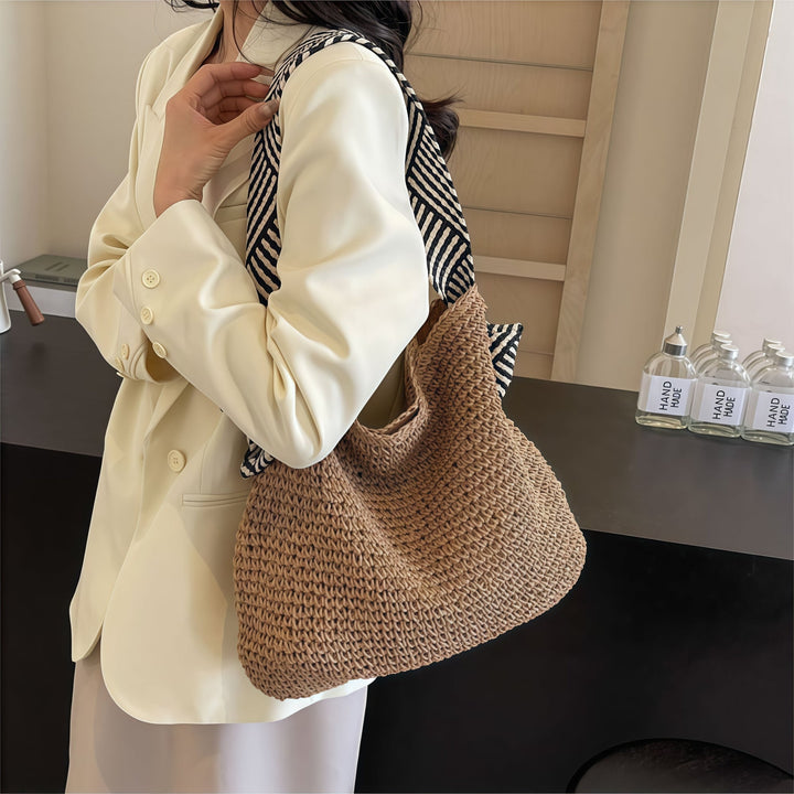 Side view of natural beige boho shoulder bag showing spacious roomy interior opening