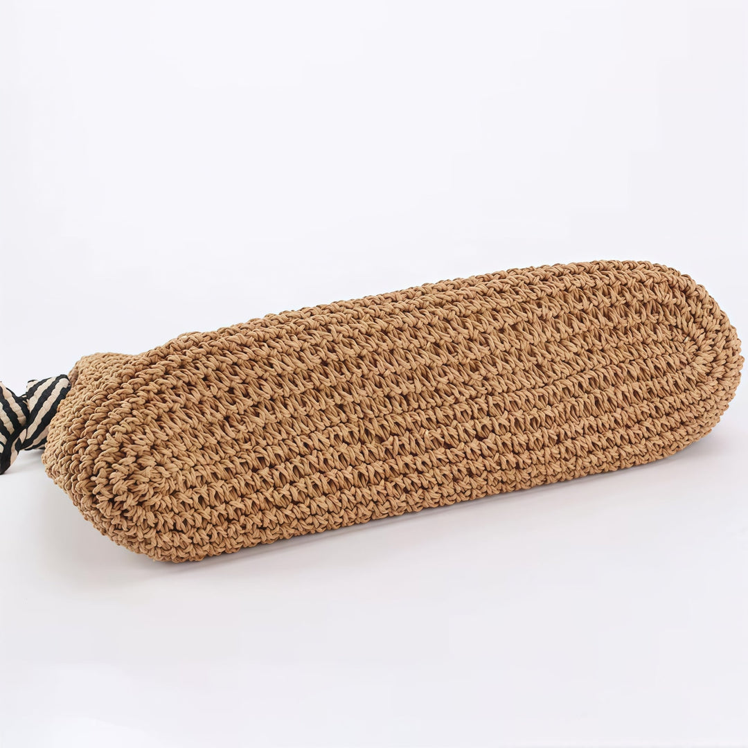 Detail shot of magnetic closure on handwoven boho shoulder bag in natural beige