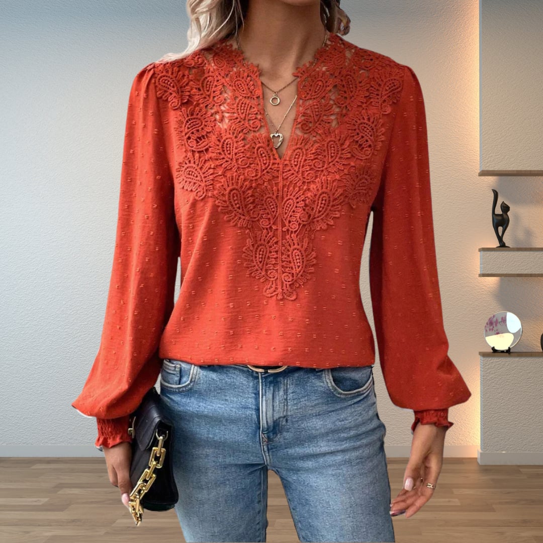 Woman wearing the Colette lightweight blouse in red, showcasing its flattering tailored silhouette