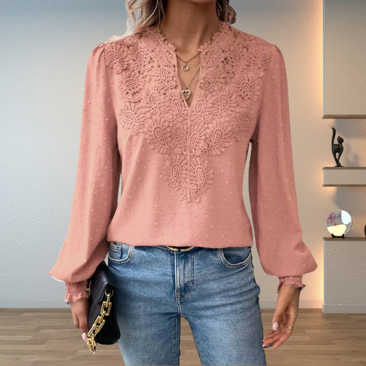 Model wearing the Colette blouse in white, dressed up for an elegant evening look