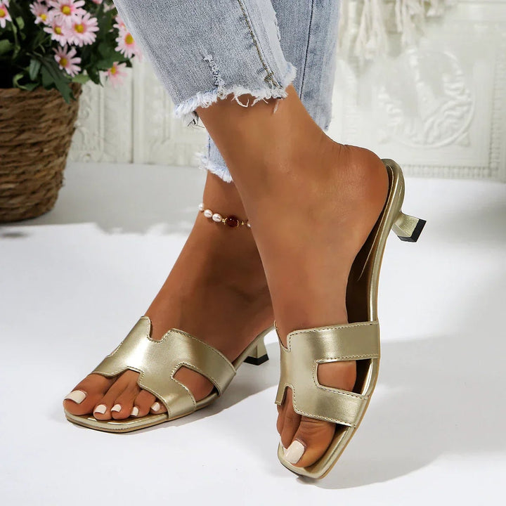 Colette women's flat sandals in black and white side by side showing color options