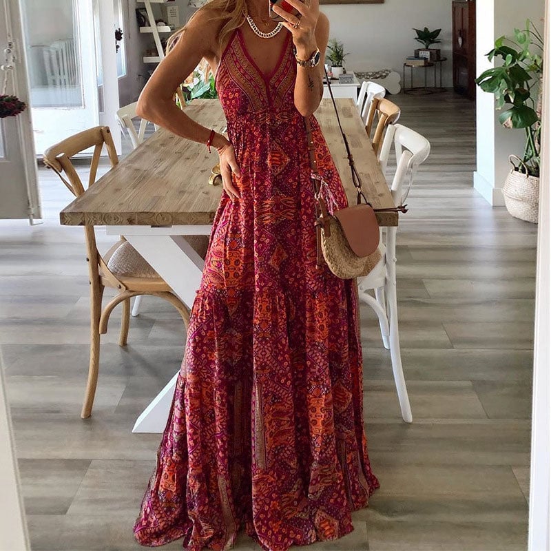 Close-up of the Colette maxi dress V-neckline and soft draped fabric in red