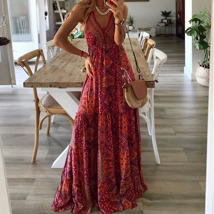 Close-up of the Colette maxi dress V-neckline and soft draped fabric in red