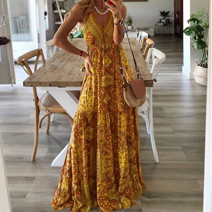 Model wearing the Colette spaghetti strap maxi dress in yellow, styled with sandals outdoors