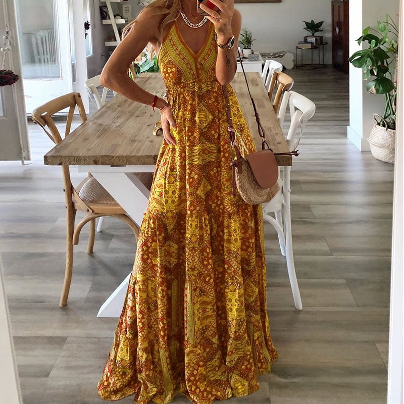 Model wearing the Colette spaghetti strap maxi dress in yellow, styled with sandals outdoors