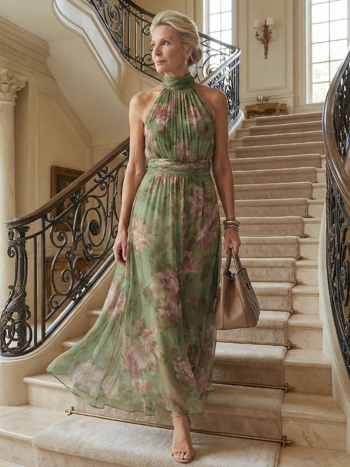 Full-length back view of the Colette green floral halter midi dress