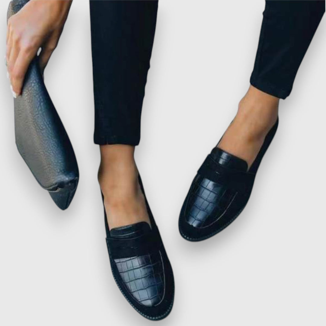 Top-down view of cushioned slip-on loafers highlighting sophisticated detailing and polished finish
