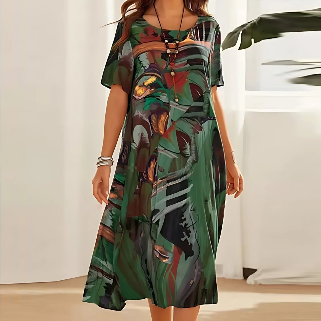 Front view of a green floral dress with soft fabric and feminine fit, shown on a model