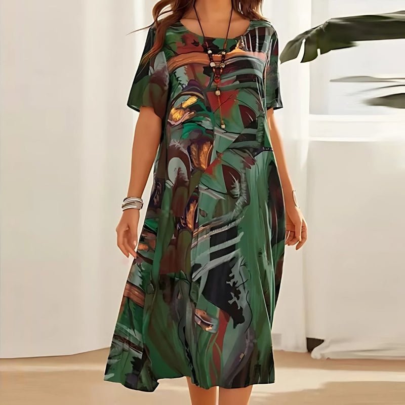 Front view of a green floral dress with soft fabric and feminine fit, shown on a model