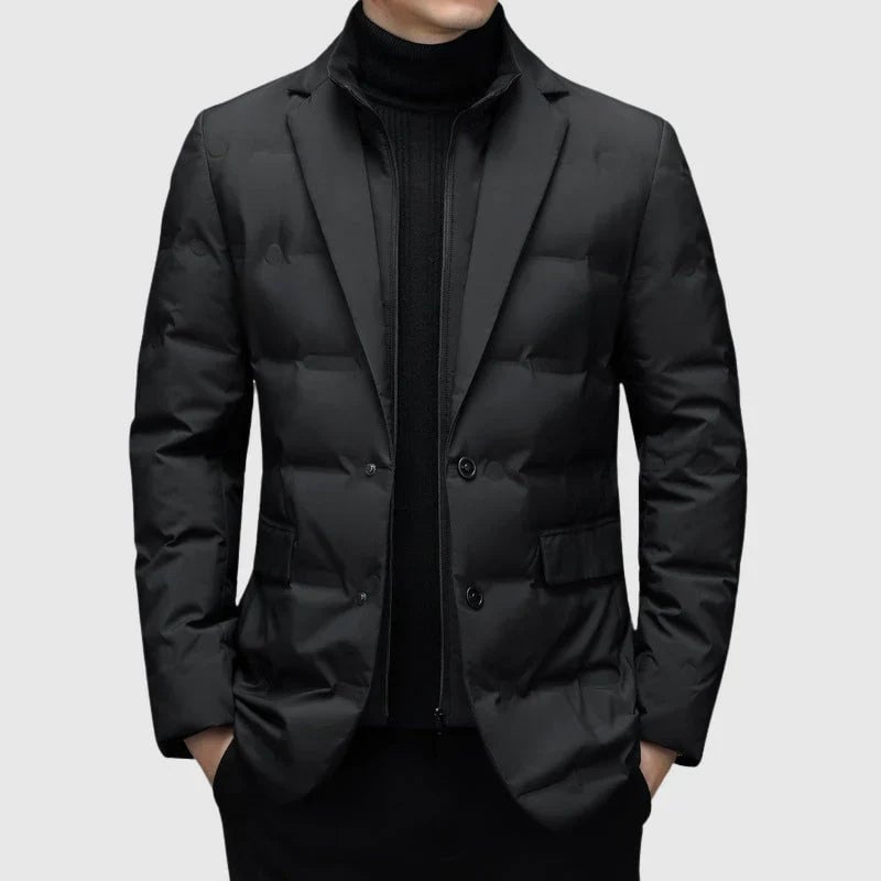 Model wearing a structured padded winter blazer in a neutral tone, front view showing clean tailored lines