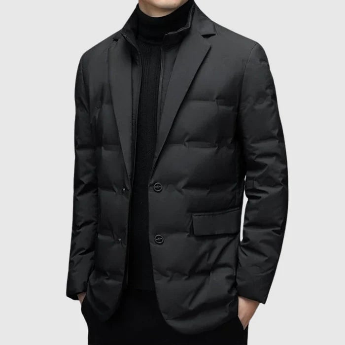 Close-up of padded winter blazer fabric and lapel detail highlighting refined tailoring and insulated lining