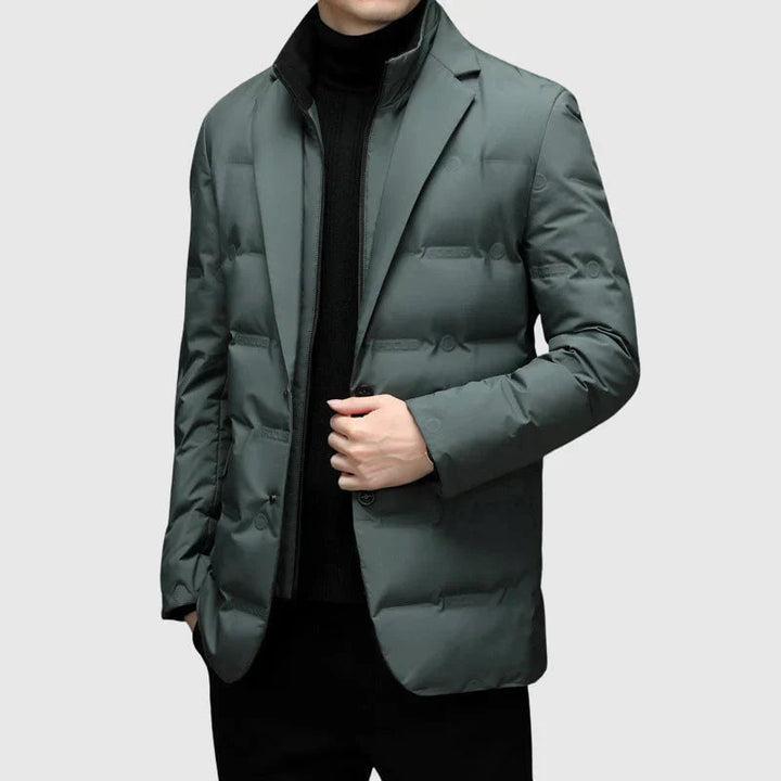 Padded winter blazer laid flat displaying clean lines and versatile design in sage green colorway