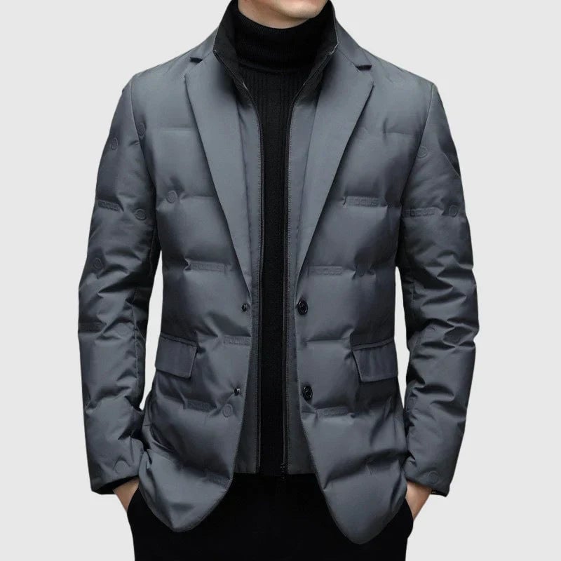 Detail shot of padded winter blazer sleeve and button closure highlighting durable high-quality fabric