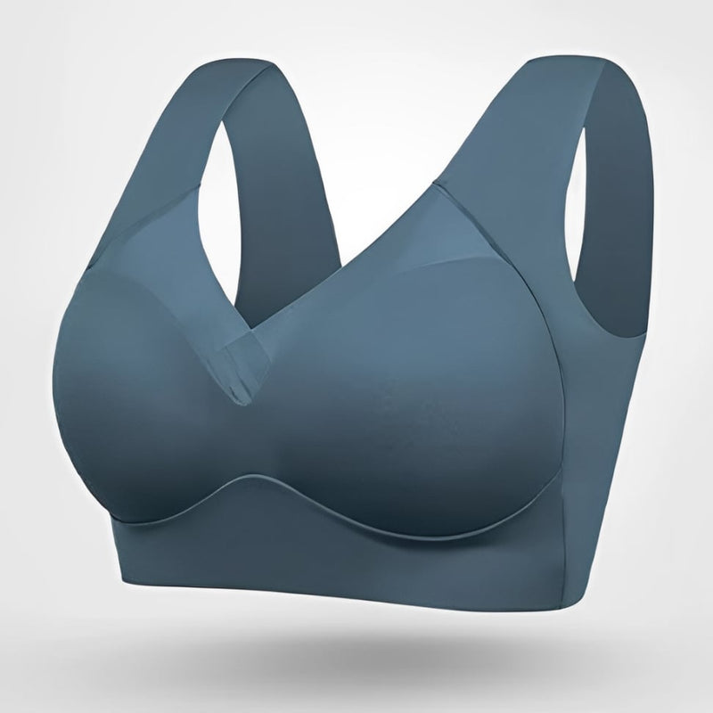 Model wearing seamless bra in beige showing natural lift and smooth silhouette under fitted top