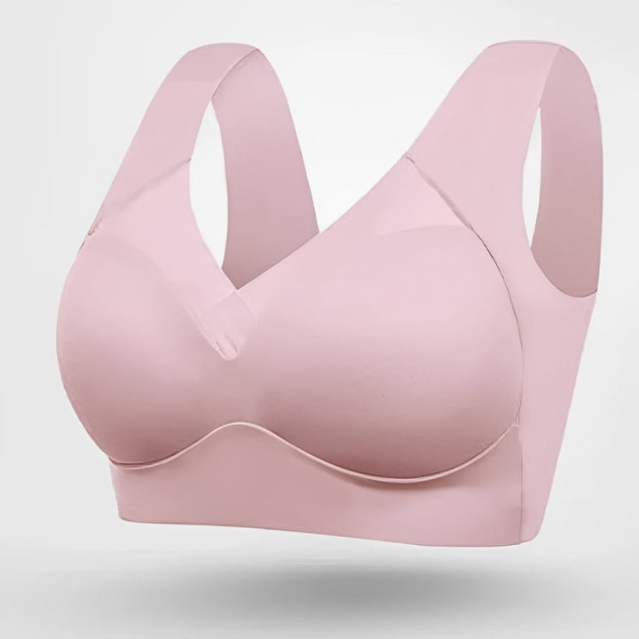 Model wearing pink seamless bra during workout demonstrating flexible fit and full coverage