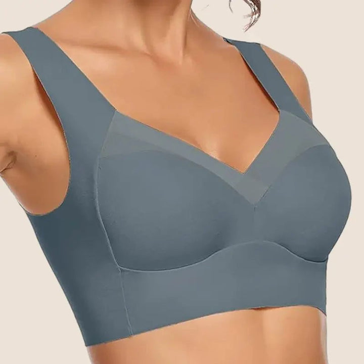 Side profile of model in seamless bra highlighting back-smoothing fit and no-bulge design