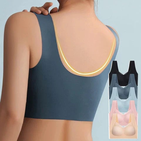 Model in beige seamless bra in yoga pose showcasing flexible four-way stretch