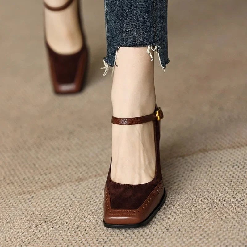 Close-up of brogue stitch detailing on the upper of the Constance brown block heel pump