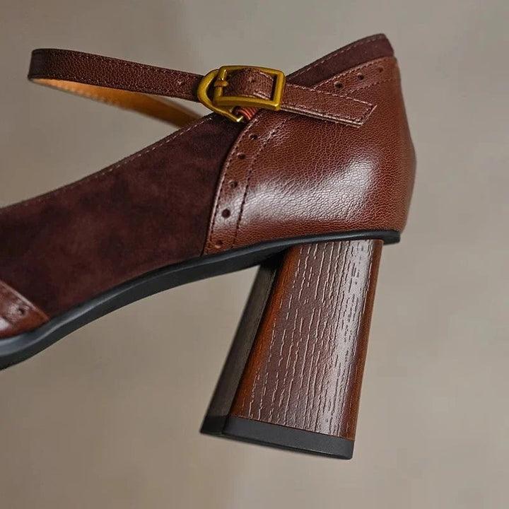 Constance black block heel pump, side profile showing square toe silhouette and mid-height heel