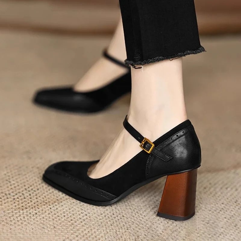 Close-up of brogue stitching on the upper of the Constance black ankle strap pump