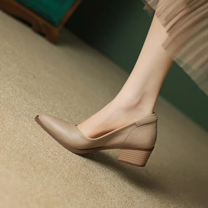 Cora block heel pumps in black, front angle highlighting pointed toe