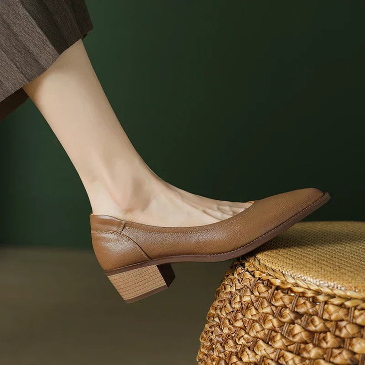 Pair of Cora pumps in apricot styled with tailored trousers, full outfit view