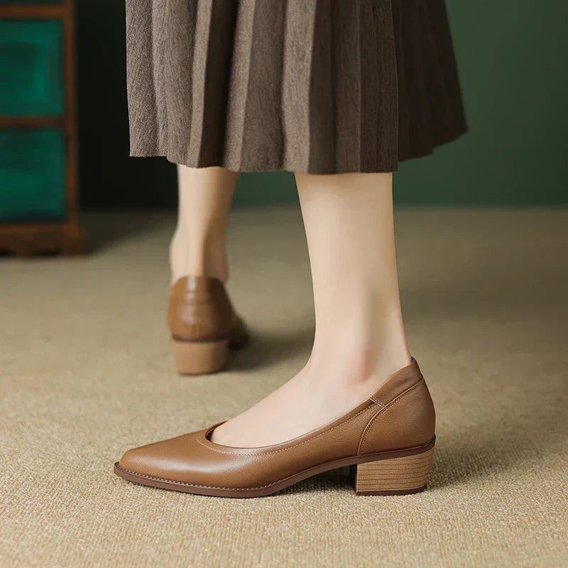 Close-up of Cora pump heel and sole detail in black