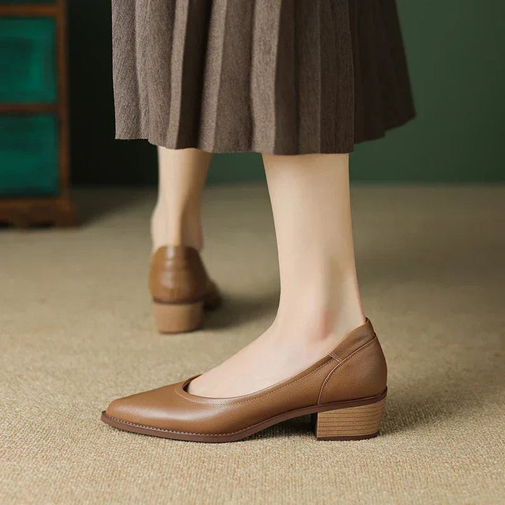 Close-up of Cora pump heel and sole detail in black