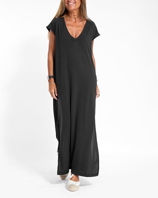 Front view of red V-neck maxi dress showing flowing silhouette and side slit detail