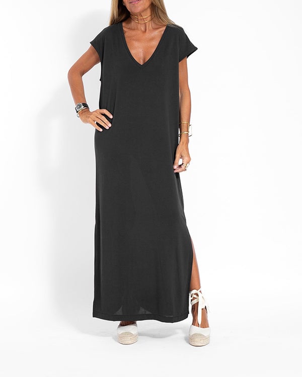 Close-up of V-neckline on women's flowing red maxi dress