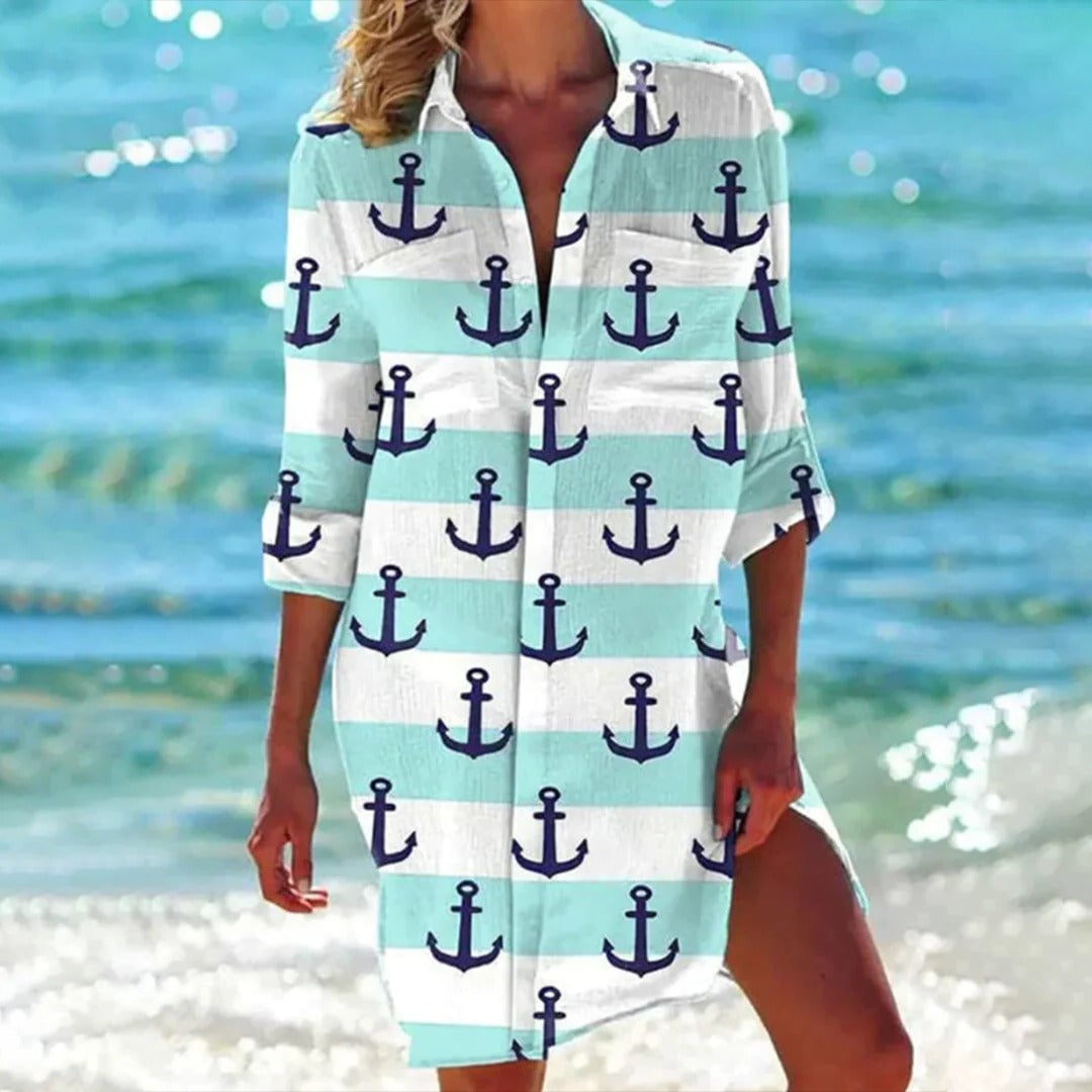 Women styling the Coralie shirt dress in mint green as a beach cover-up with flat sandals
